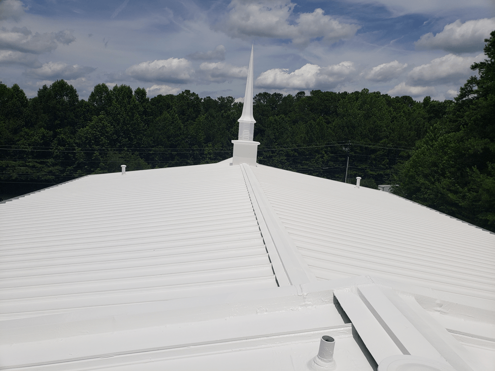 a white roof with a steeple on top of it