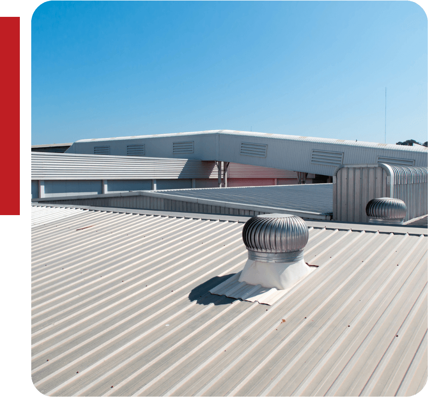 the roof of a building has a wind turbine on it