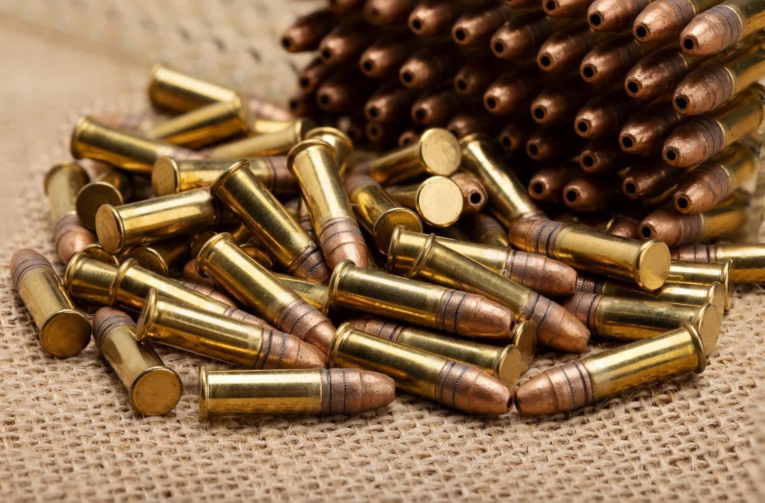 A Pile of Brass Bullets Sitting on Top of a Table — Mackay Shooters Supplies in Paget, QLD