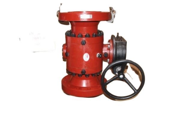Red industrial valve with a black handwheel on a white background