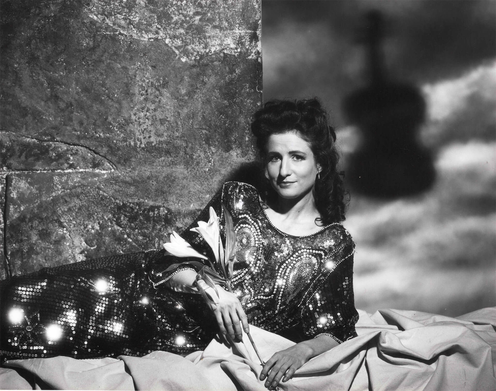 madeleine mitchell laying down with flowers black and white