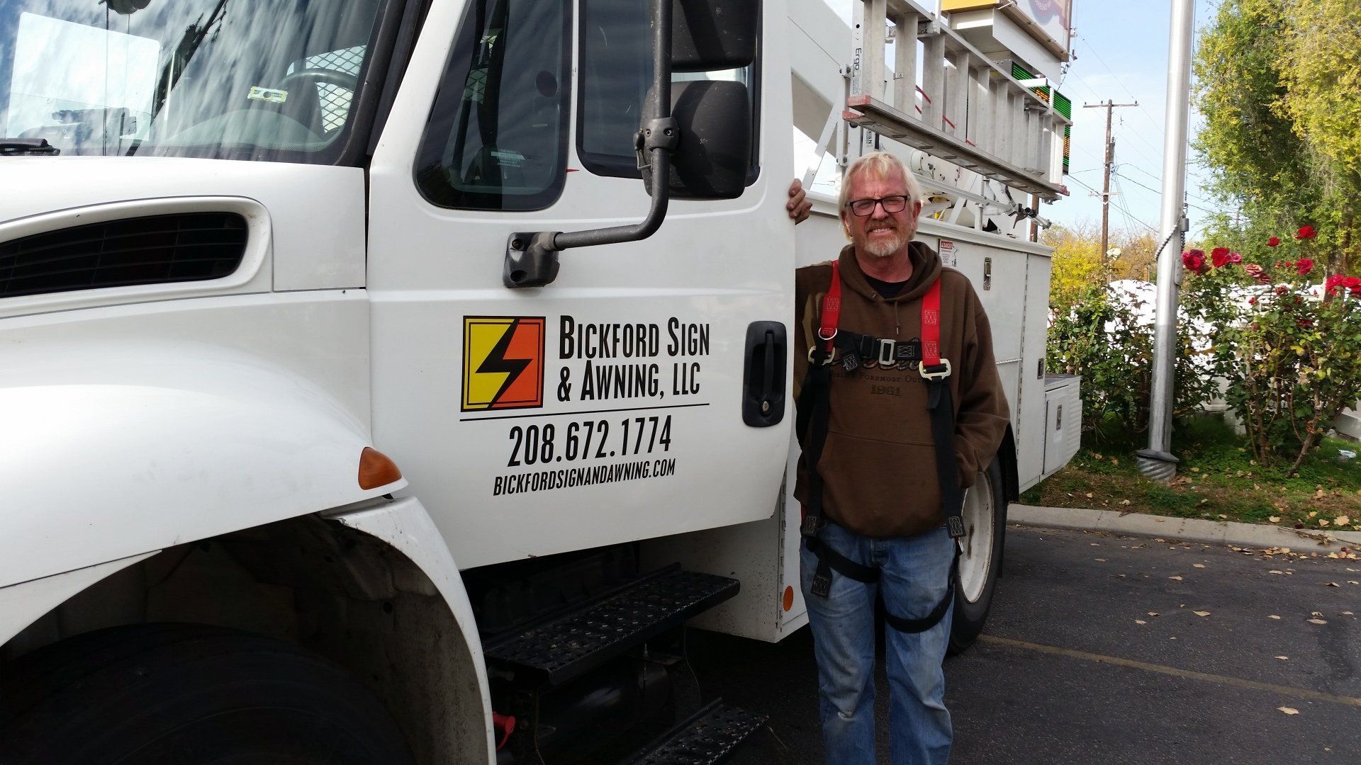 Man Standing Next to Truck