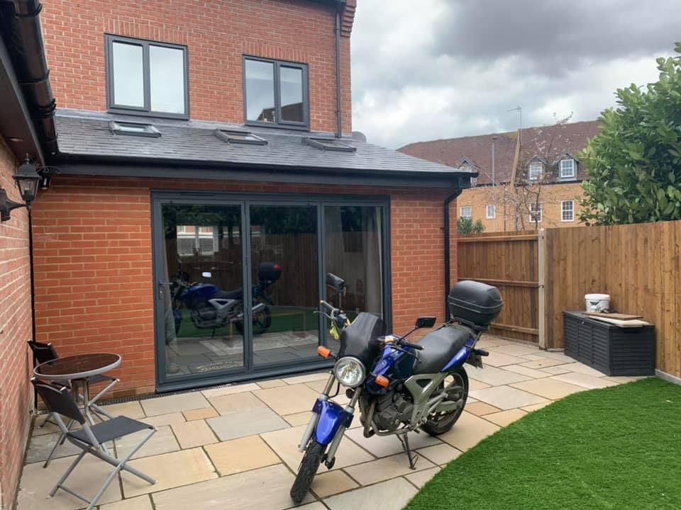 A beautiful rear single storey extension with a patio in front of it, built by Pro Build East Ltd.