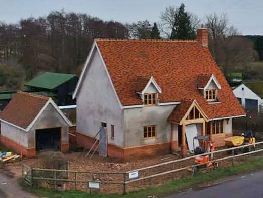An aerial view of a house under construction with a red roof., built by Pro Build East Ltd.
