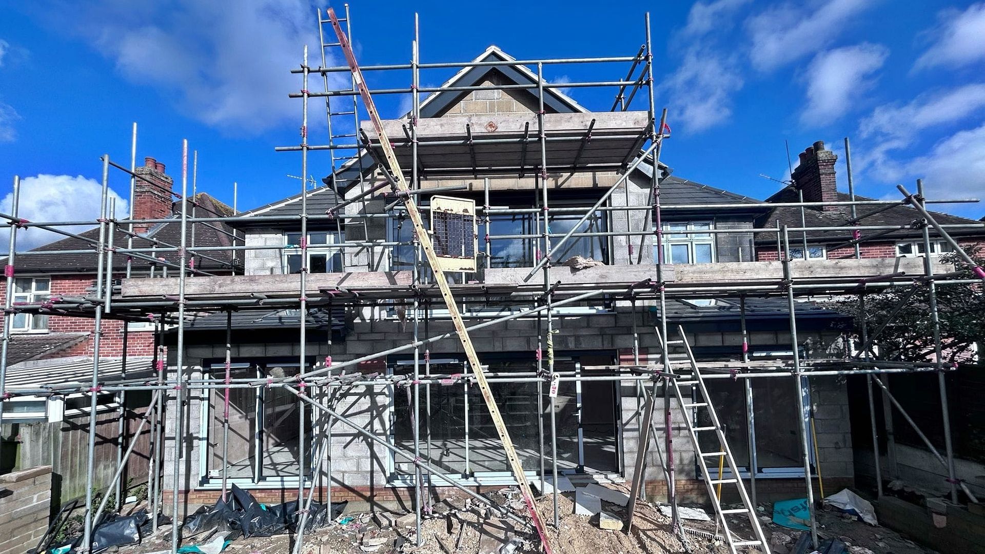 Pro Build East Ltd is best Hadleigh Builder and this is an example of scaffolding and exterior windows being installed.
