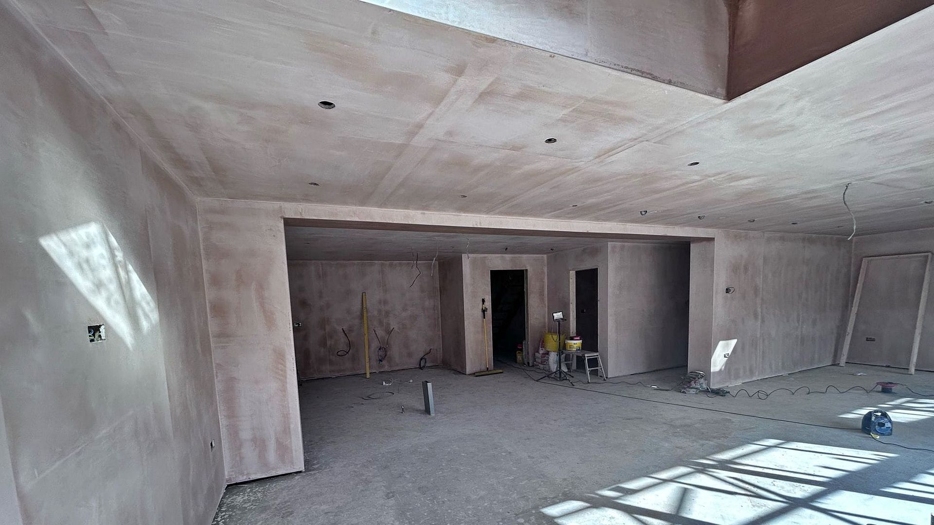 Pro Build East Ltd is best Hadleigh Builder and this is an example of liquid screed flooring over underfloor heating and plastered walls.