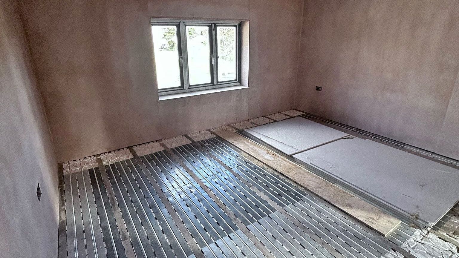 Pro Build East Ltd is best Hadleigh Builder and this is an example of underfloor heating and plastered walls.