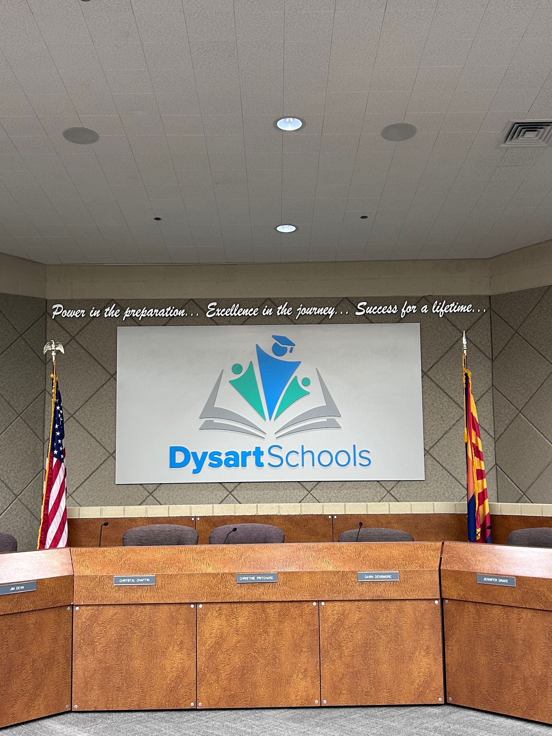 A boardroom with a sign that says dysartschools on it
