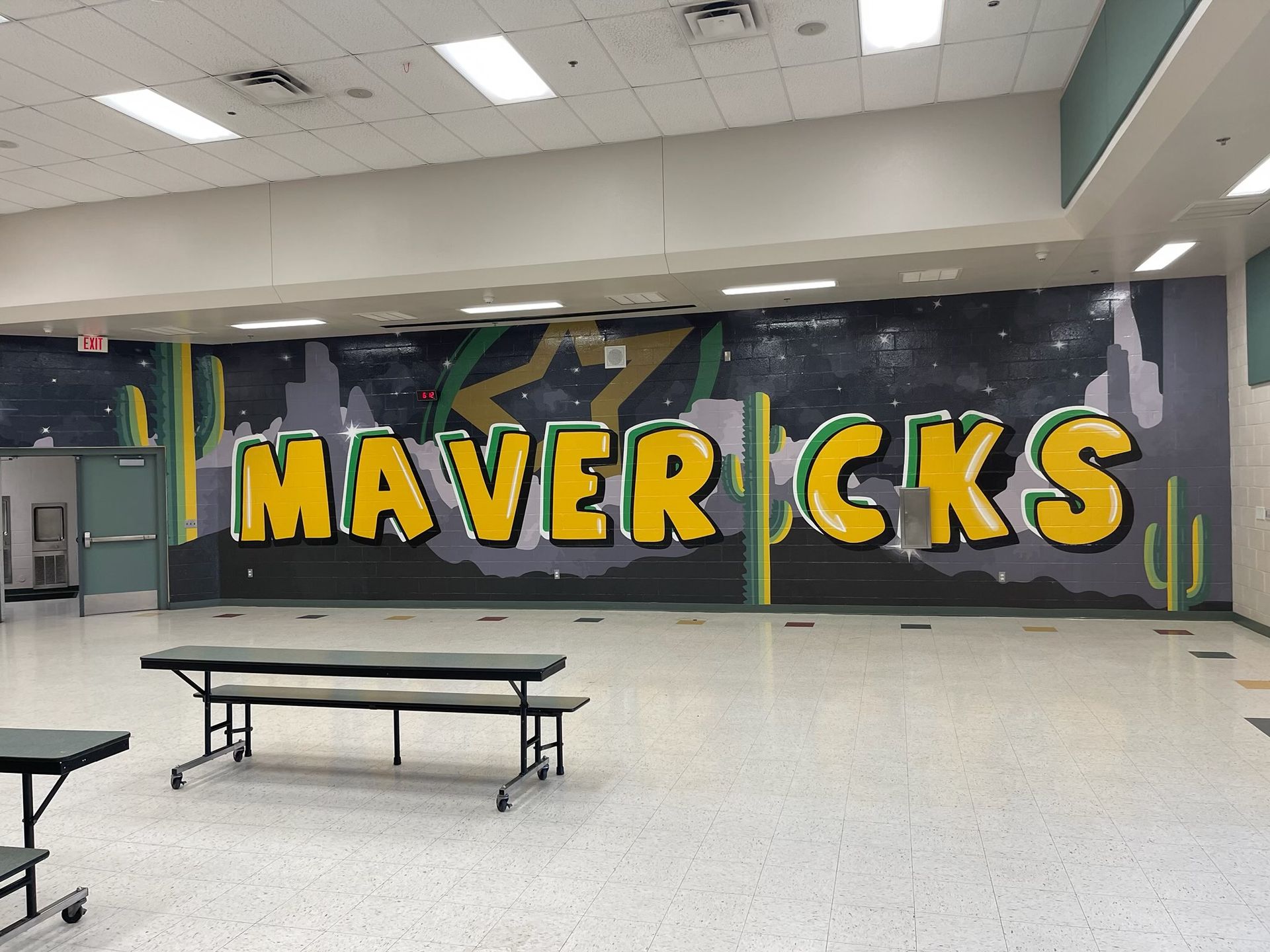 The word mavericks is painted on the wall of a building