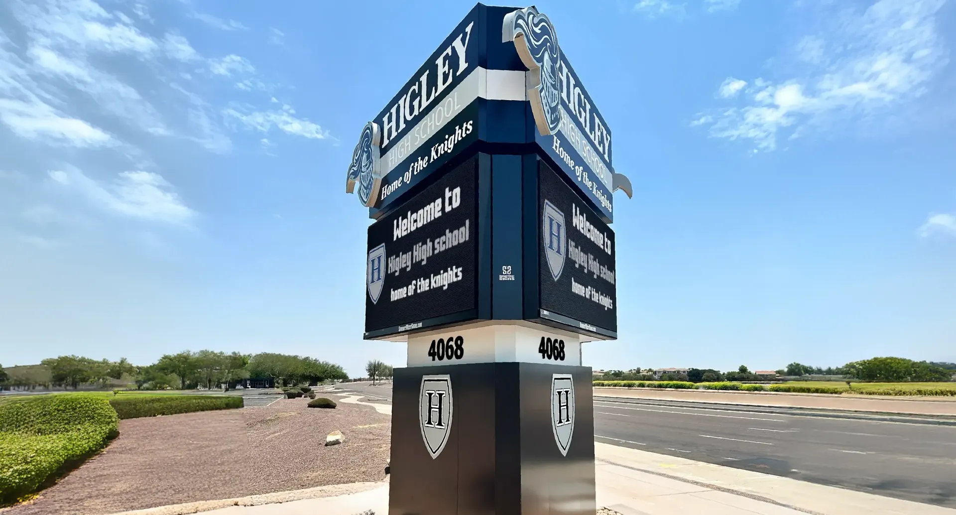 A large tower with a sign on top of it.