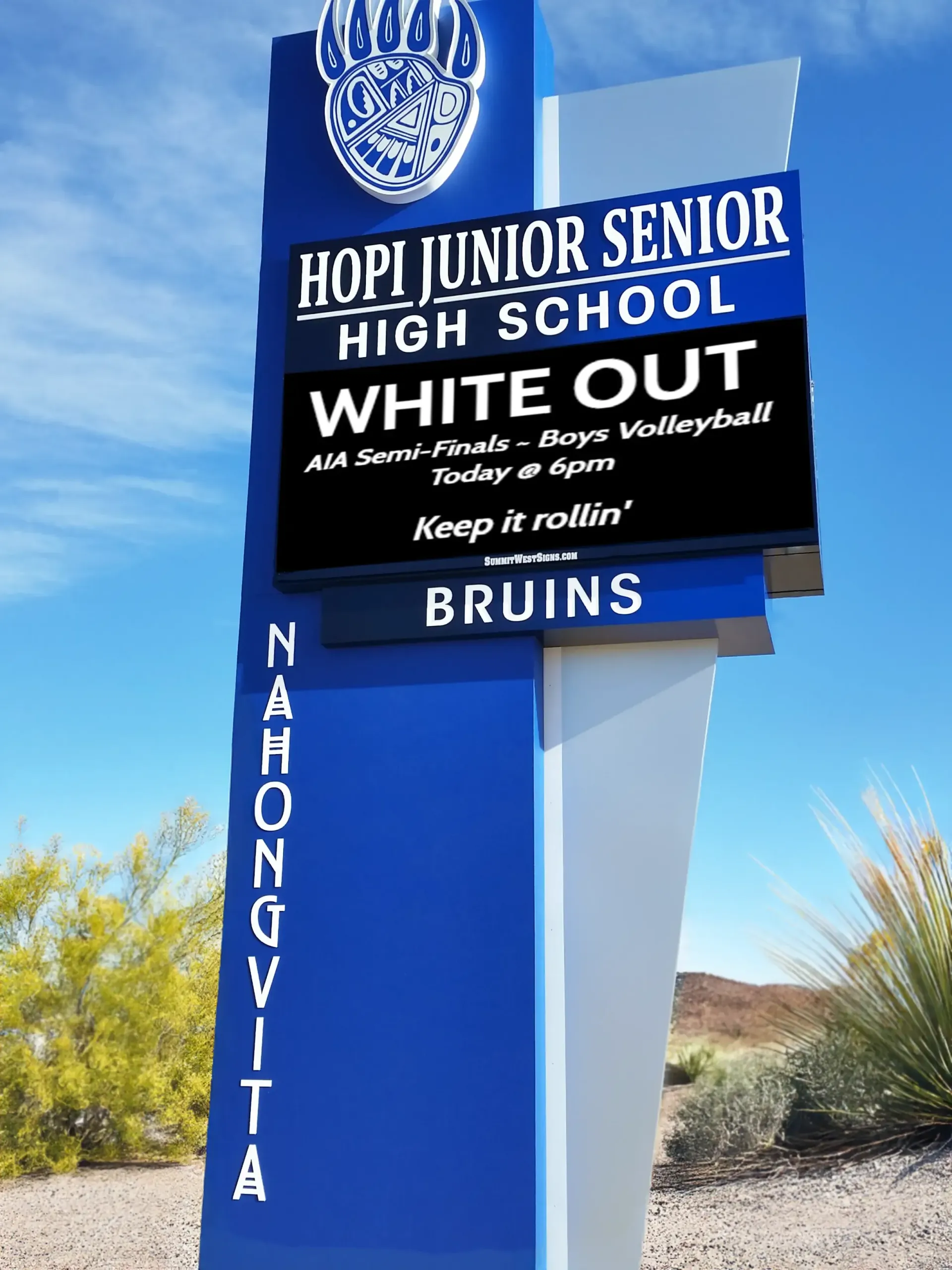 A blue sign for hopi junior senior high school