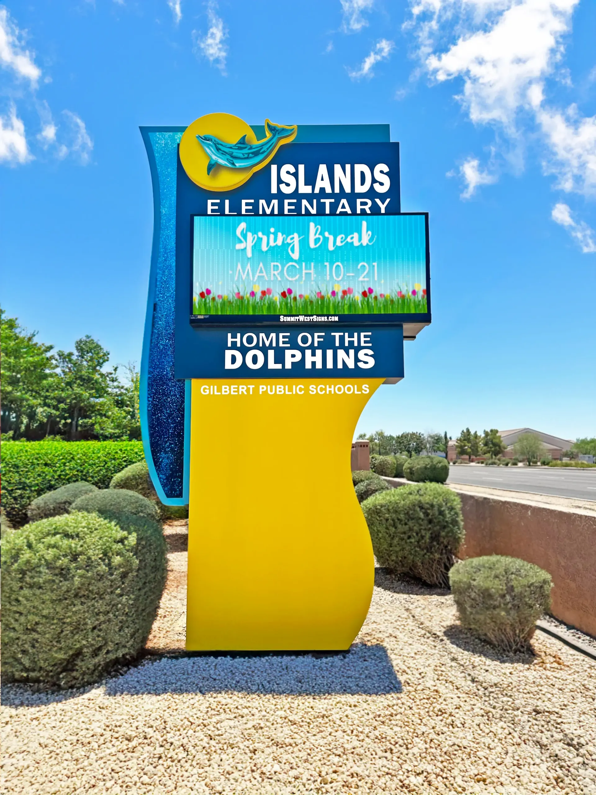 A large yellow and blue sign for islands elementary school.