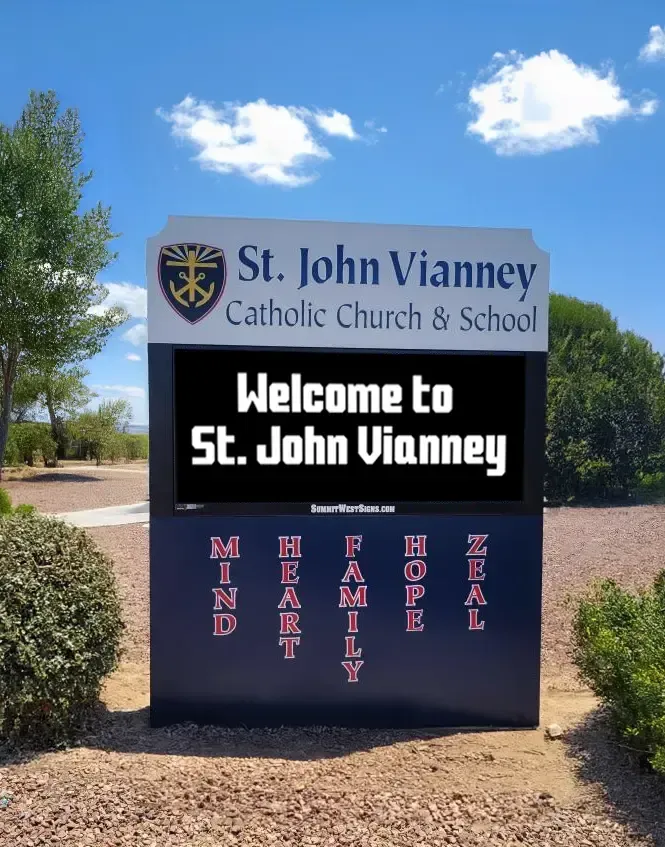 A sign for st. john vianney catholic church and school