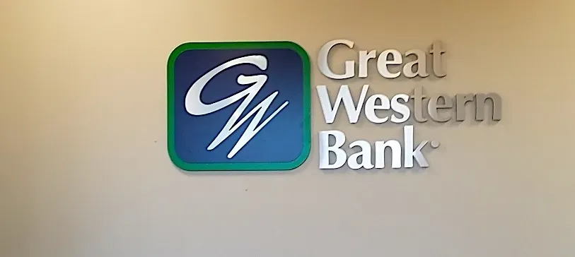 A great western bank logo is on a wall.