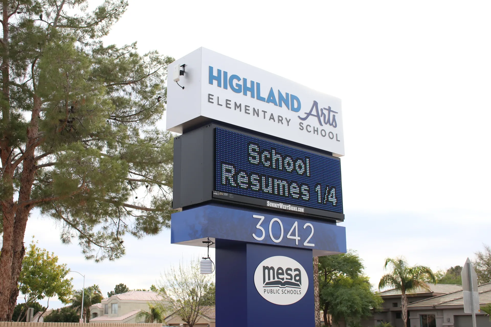 A large sign for highland arts elementary school