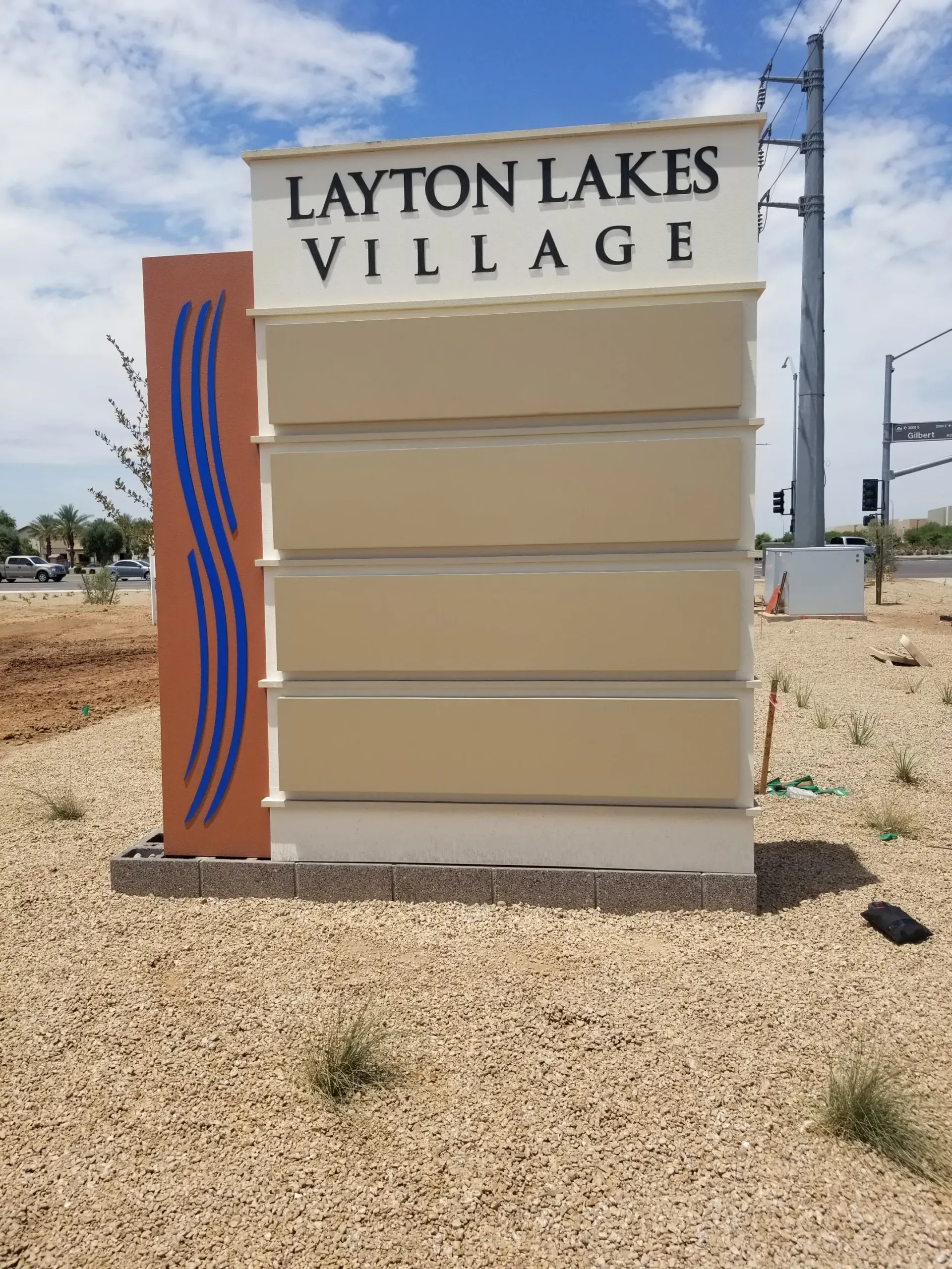 A sign that says layton lakes village on it