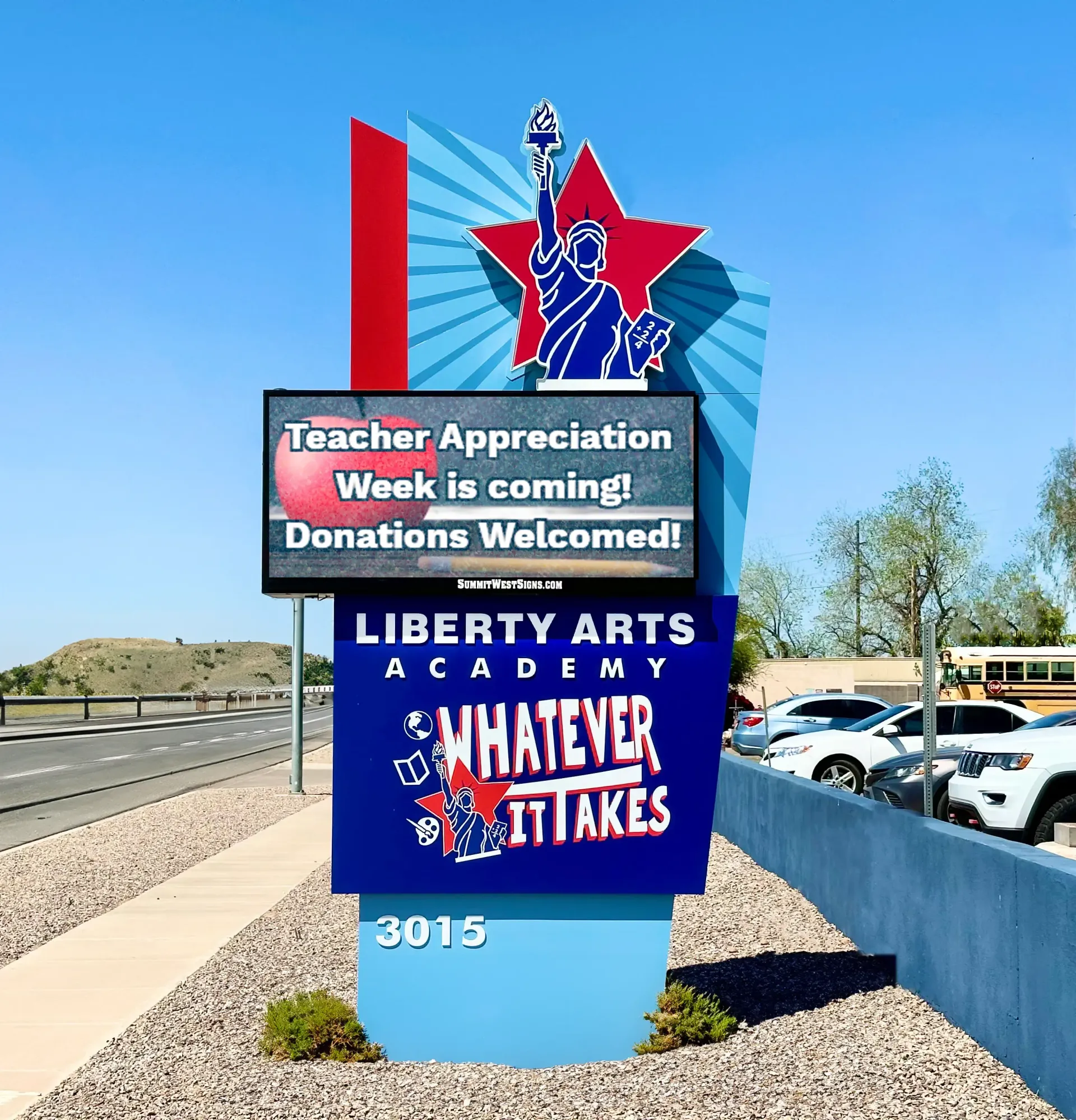A sign for liberty arts academy says that teacher appreciation week is coming