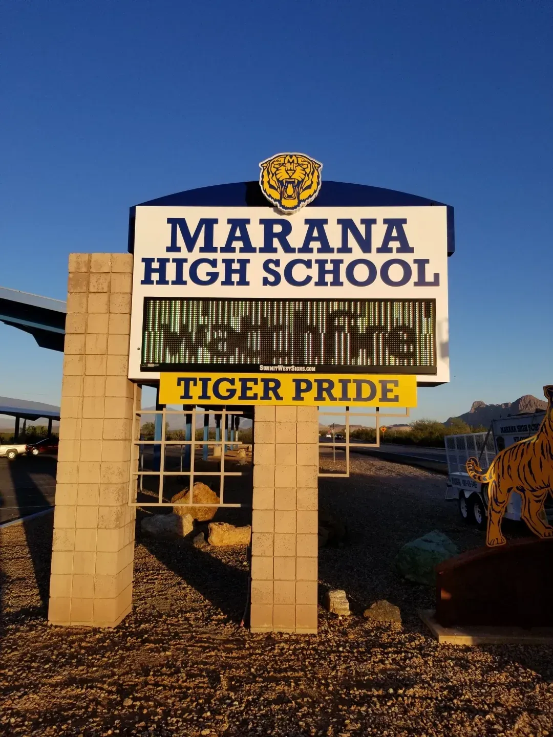 A sign that says ' maran high school tiger pride ' on it