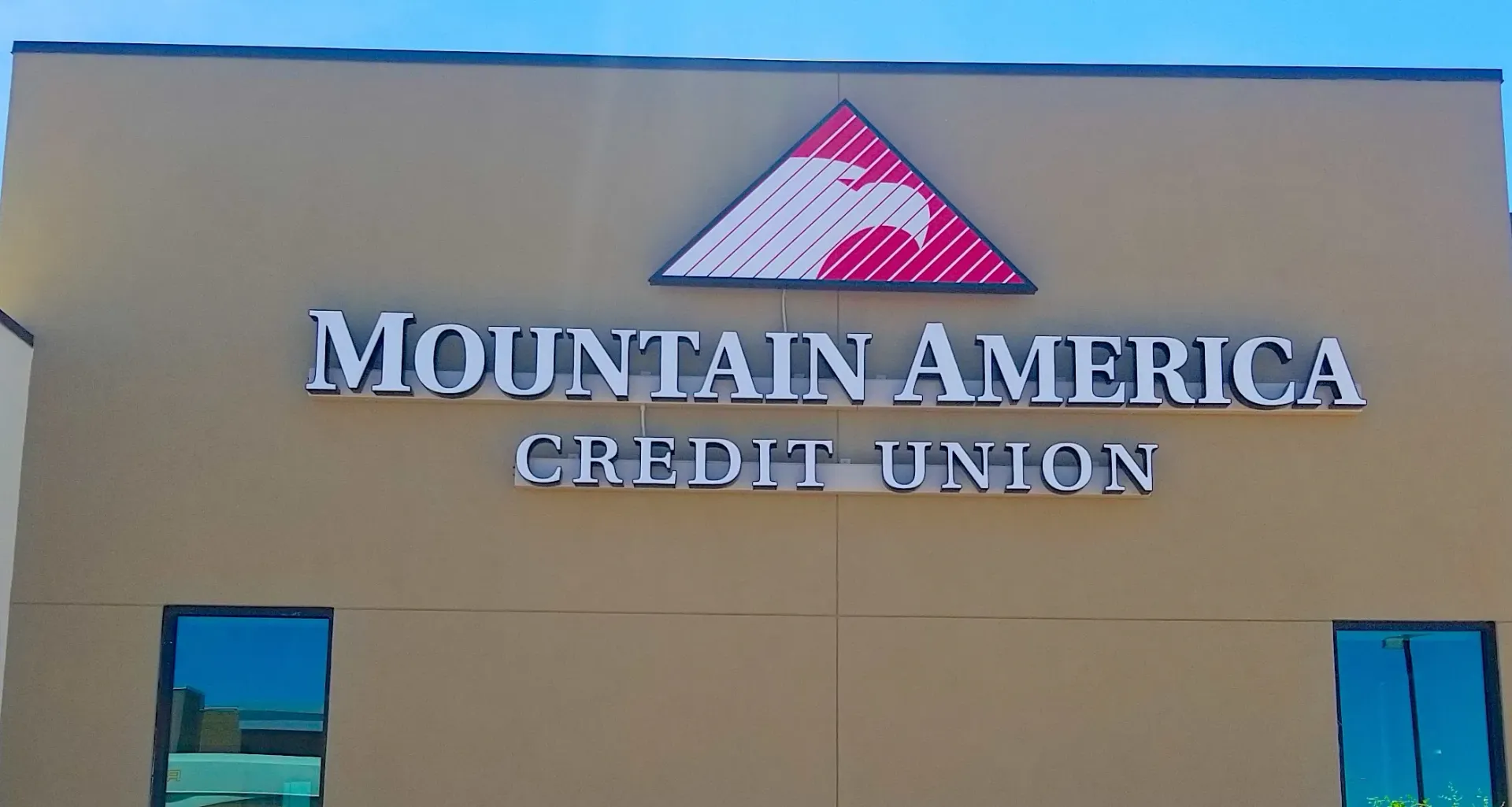 A mountain america credit union sign on the side of a building