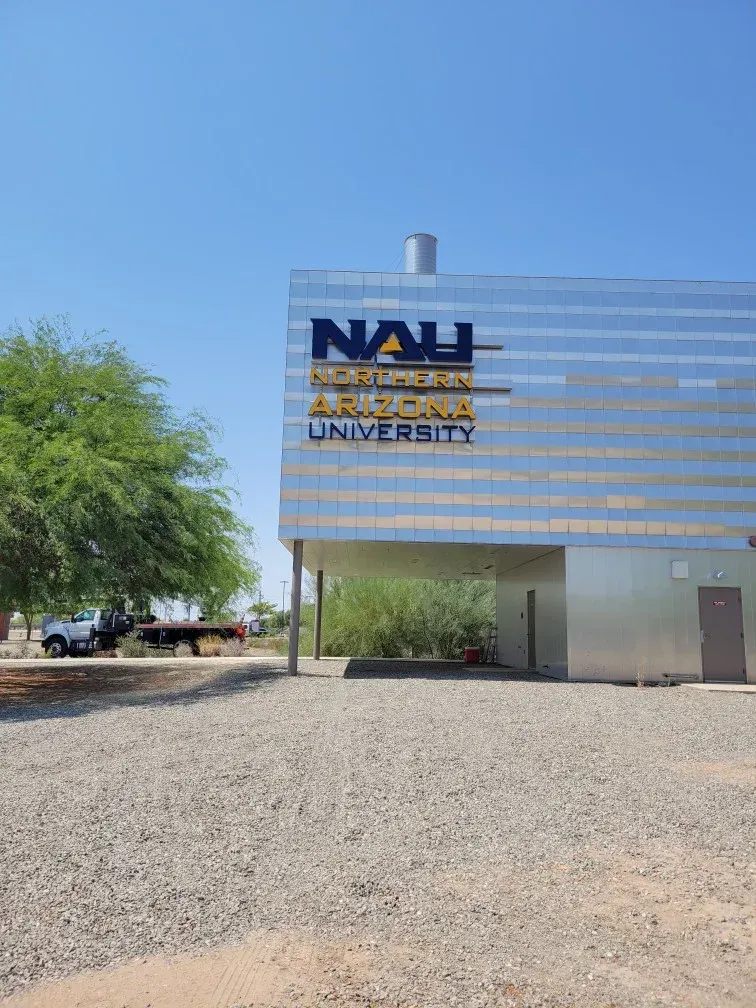 A large building with a sign that says nau on it