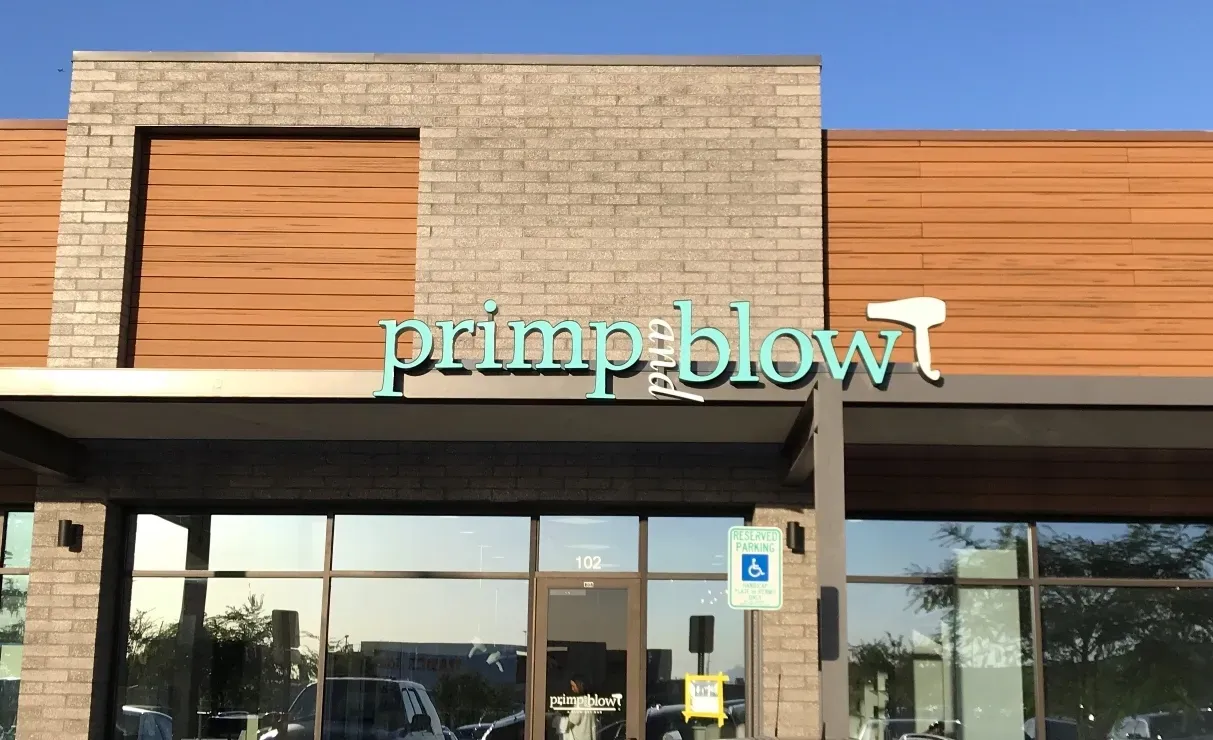 A store front with a sign that says primp blow