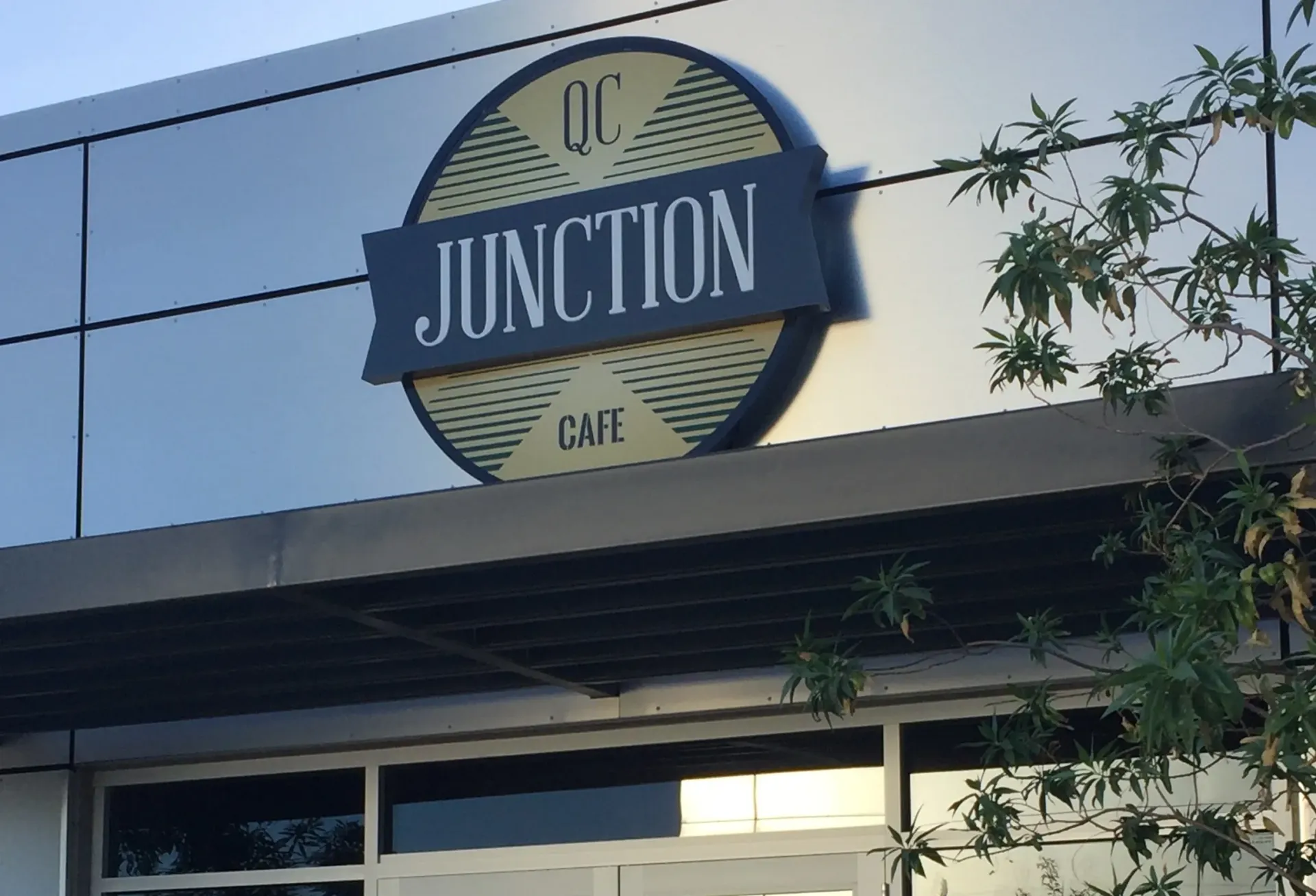A building with a sign that says uc junction cafe