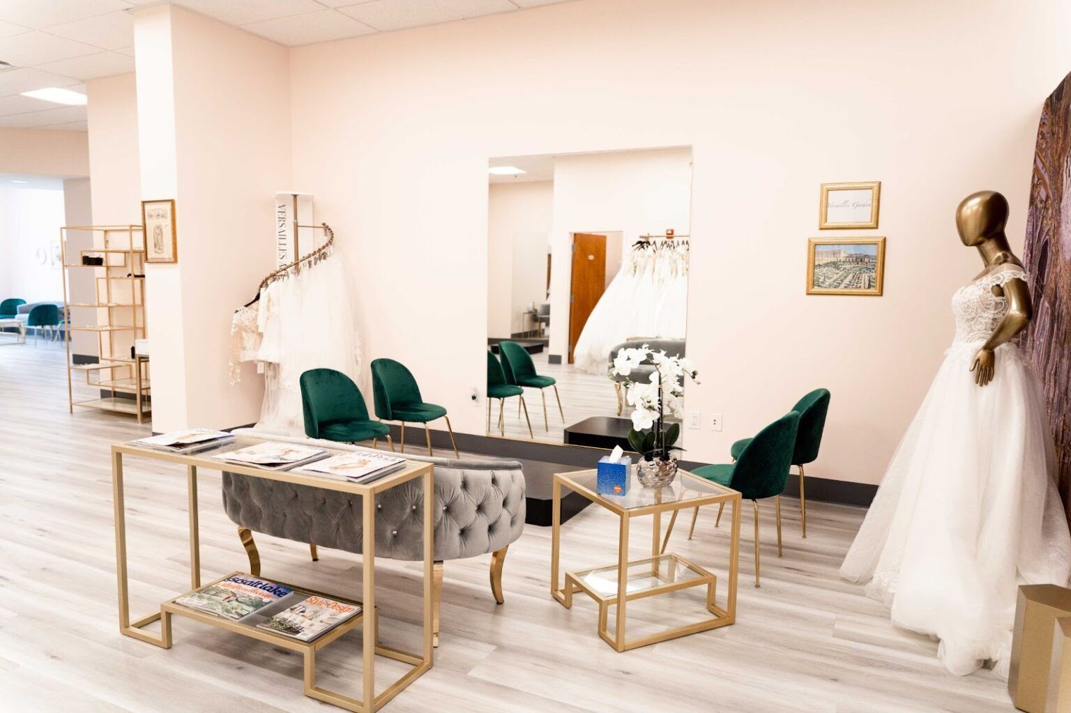 A room with a mannequin in a wedding dress and a table and chairs.