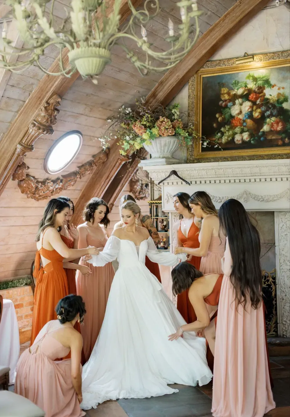 A bride is getting ready for her wedding with her bridesmaids.