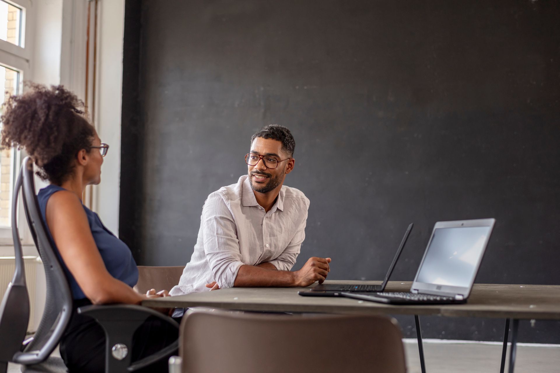 Businessman Looking At Female Manager — NYC, NY — Chrysalis Career Coaching