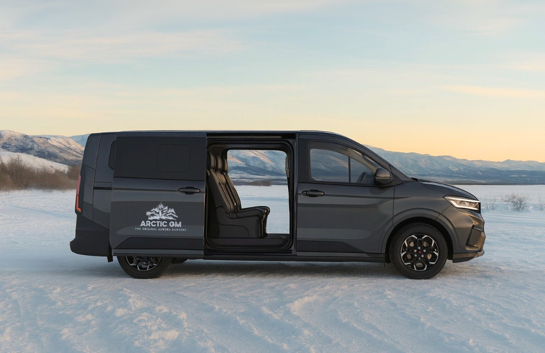 Arctic GM luxury 2025 Ford Transit Tourneo 4x4 van with leather interior, extra legroom, and sliding doors parked on snowy Arctic landscape