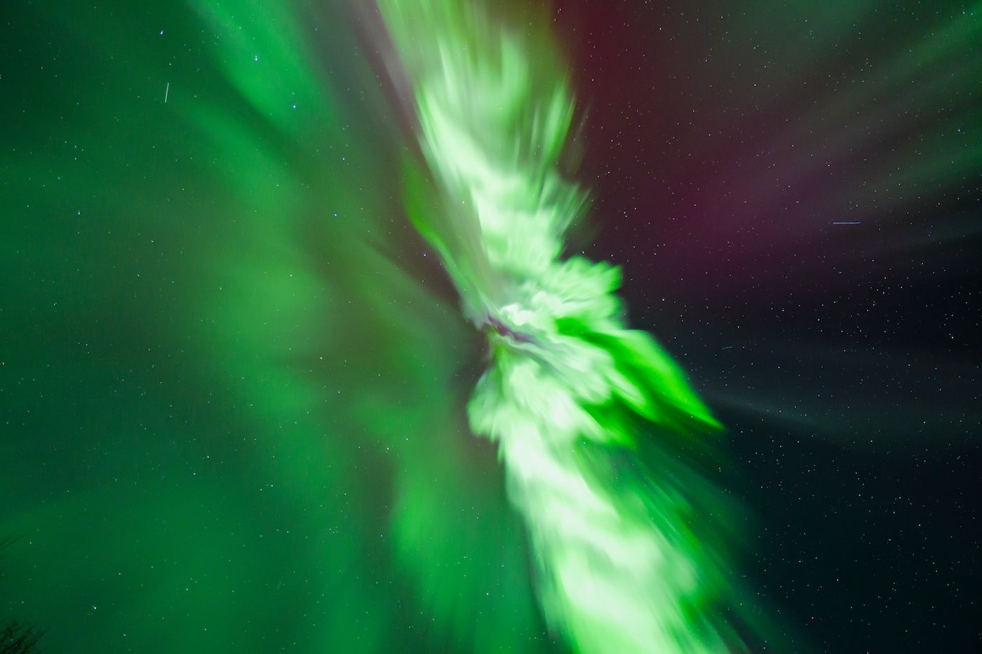 Swirling green and white Aurora over Lapland skies captured on Arctic GM photo tour
