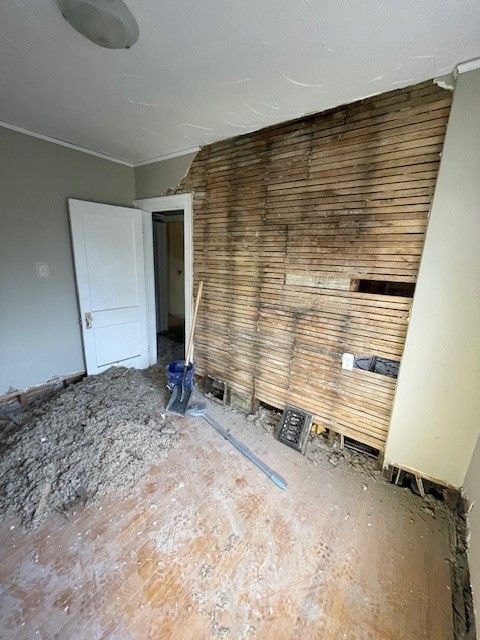 Empty Room with a Wooden Wall — Oldcastle, ON — Water Loc Inc