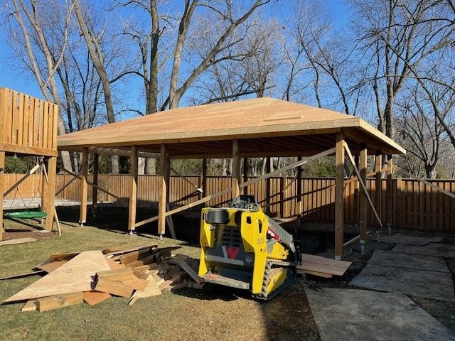 Yellow Tractor Parked on the House — Oldcastle, ON — Water Loc Inc