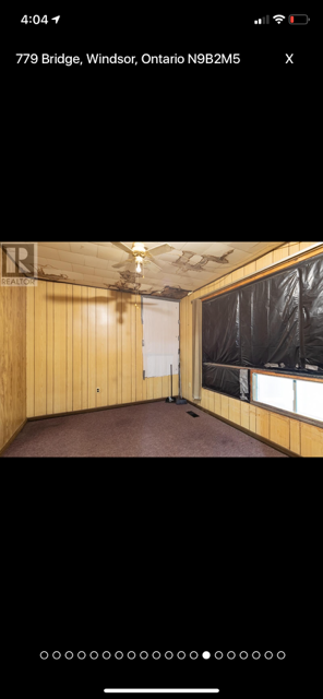 Empty Room With Wood Paneling and a Fan — Oldcastle, ON — Water Loc Inc