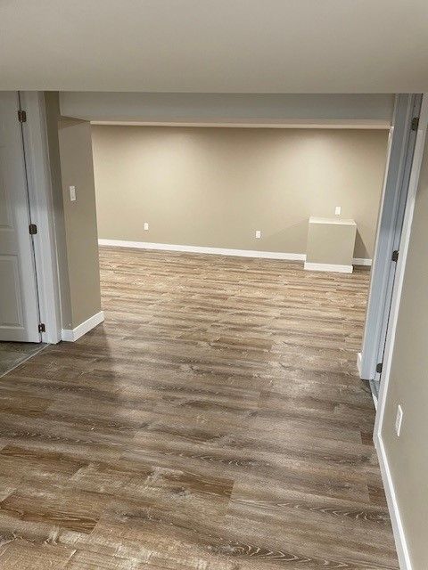 Empty Basement with Hardwood Floors — Oldcastle, ON — Water Loc Inc
