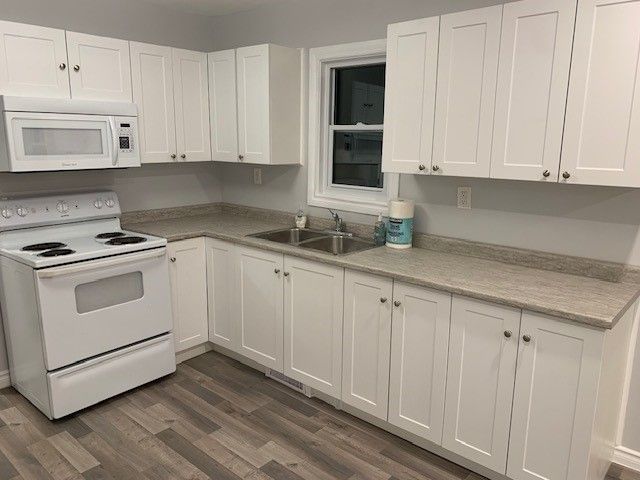 Kitchen with White Cabinets — Oldcastle, ON — Water Loc Inc