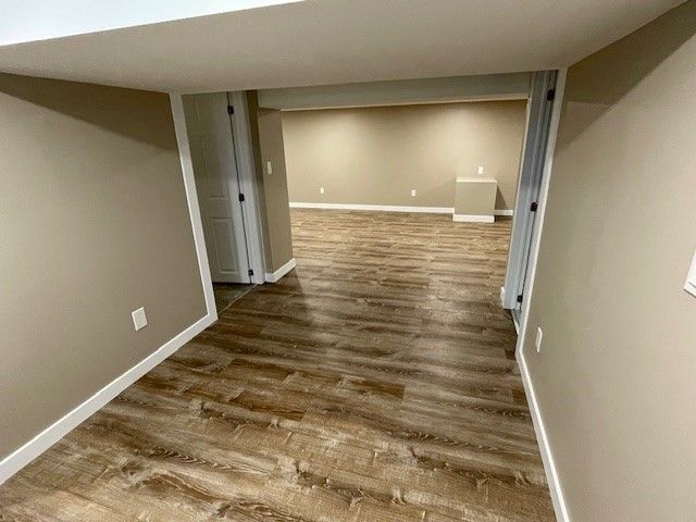 Hallway in a Basement with Hardwood — Oldcastle, ON — Water Loc Inc