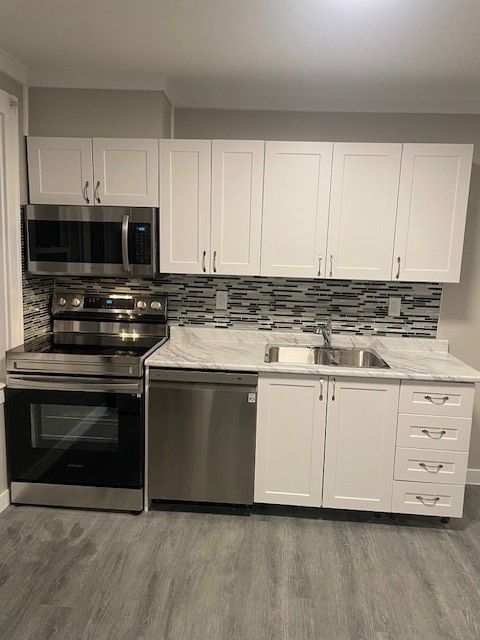 Kitchen with Steel Appliances — Oldcastle, ON — Water Loc Inc