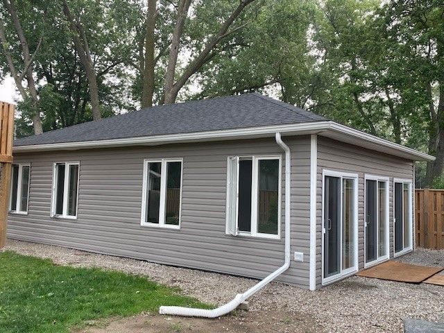 Small House with Windows — Oldcastle, ON — Water Loc Inc