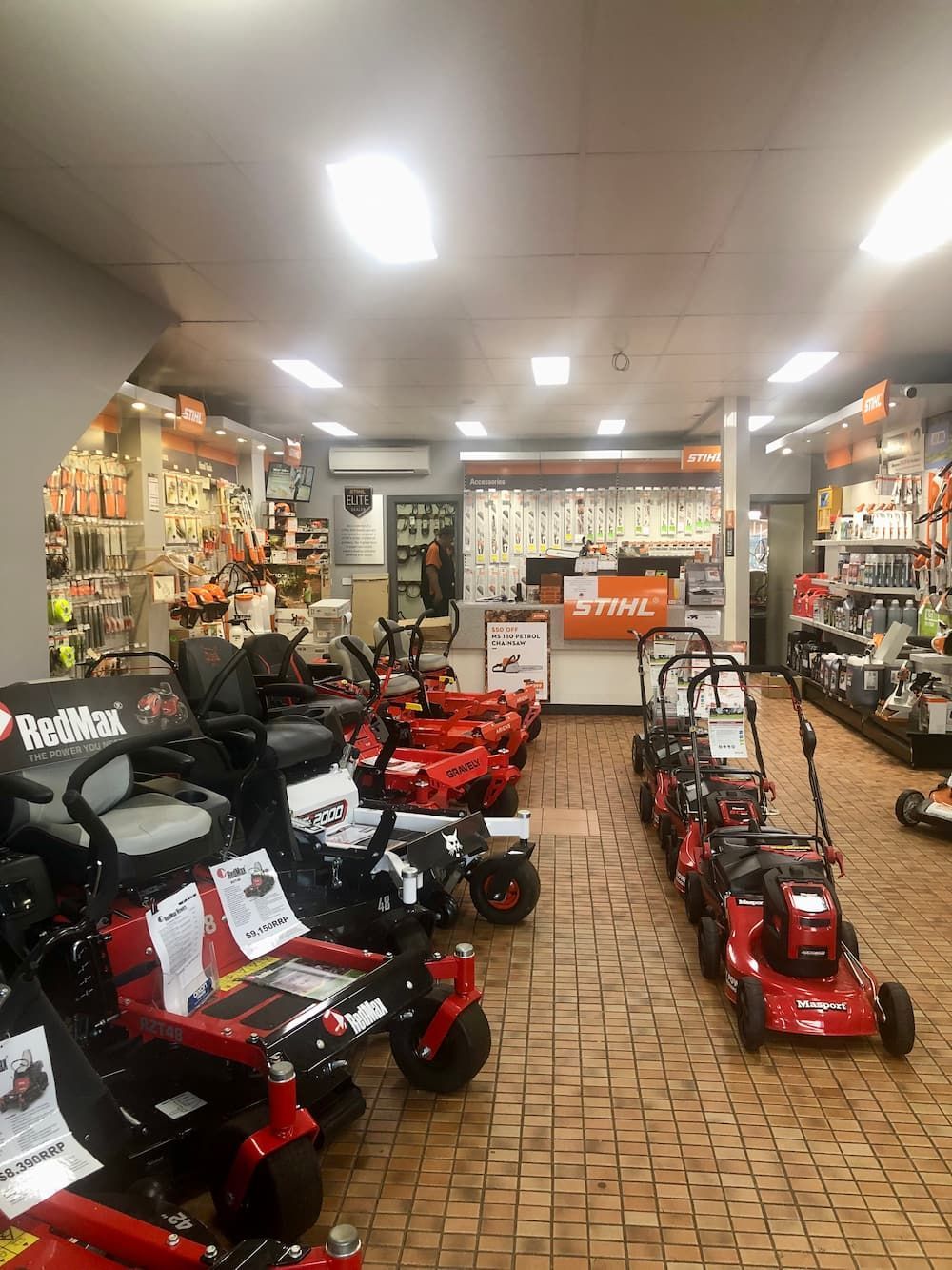 A Row of Lawn Mowers Are Lined up In a Store — Stihl Shop Grafton in Grafton, NSW
