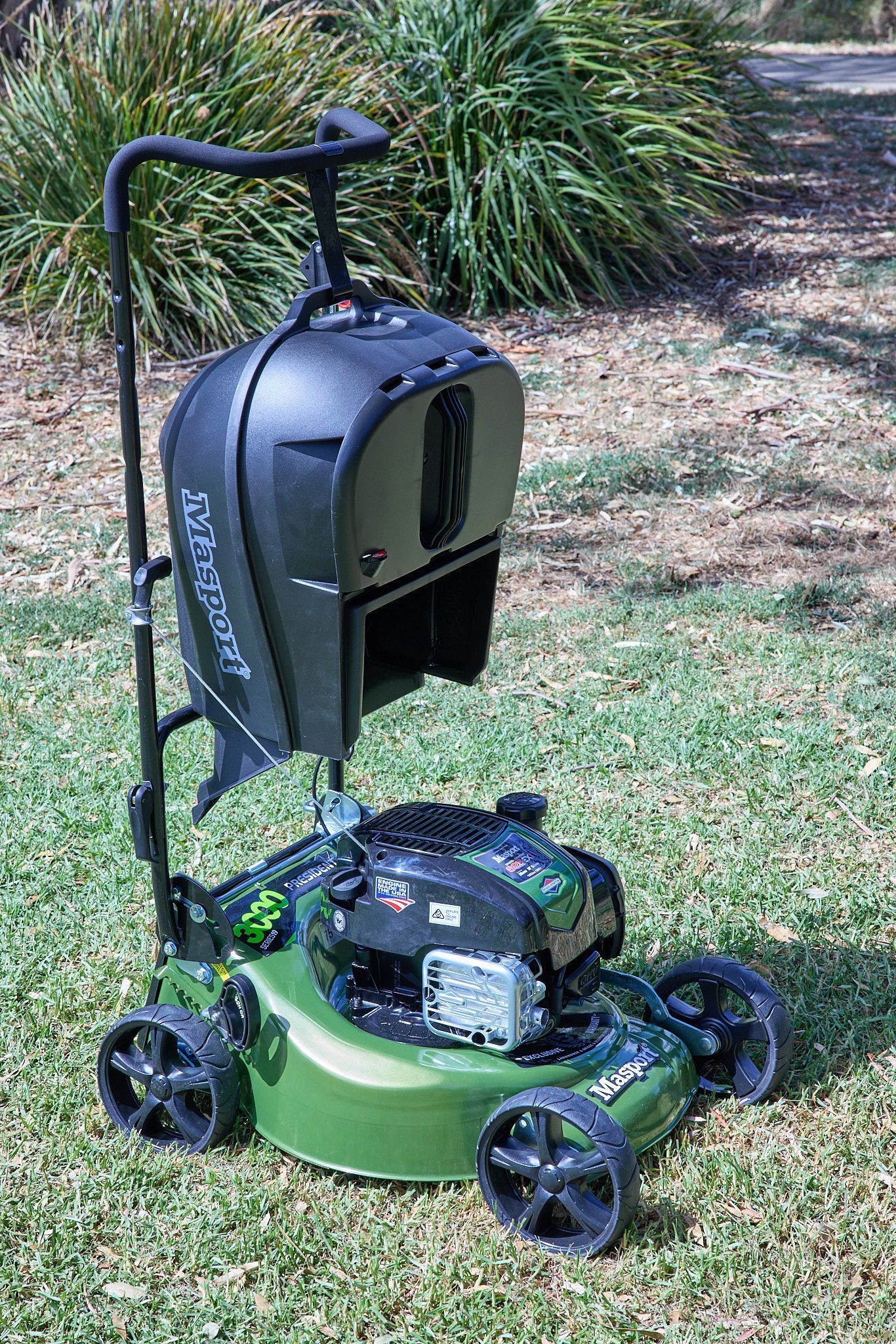 A Green Lawn Mower Is Sitting on Top of A Lush Green Lawn — Stihl Shop Grafton in Grafton, NSW
