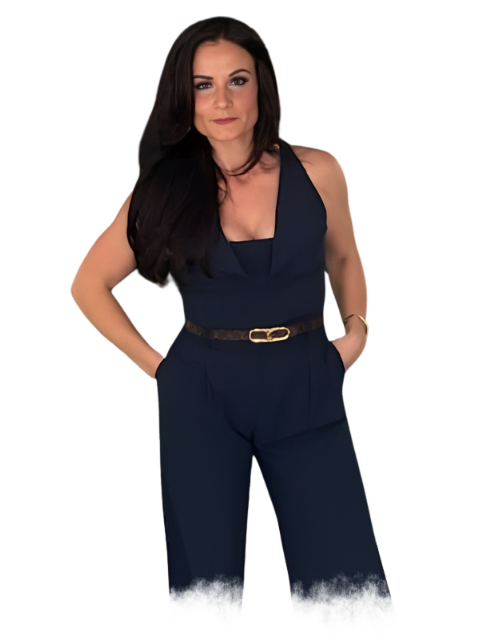 A man with a tattoo on his arm is pointing at the camera.