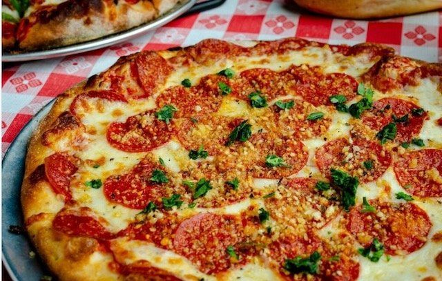 Pizza — Putting Pizza inside the Oven in Baldwin County, LA