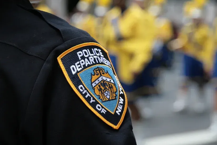 A close up of a police department patch on a police officer 's uniform