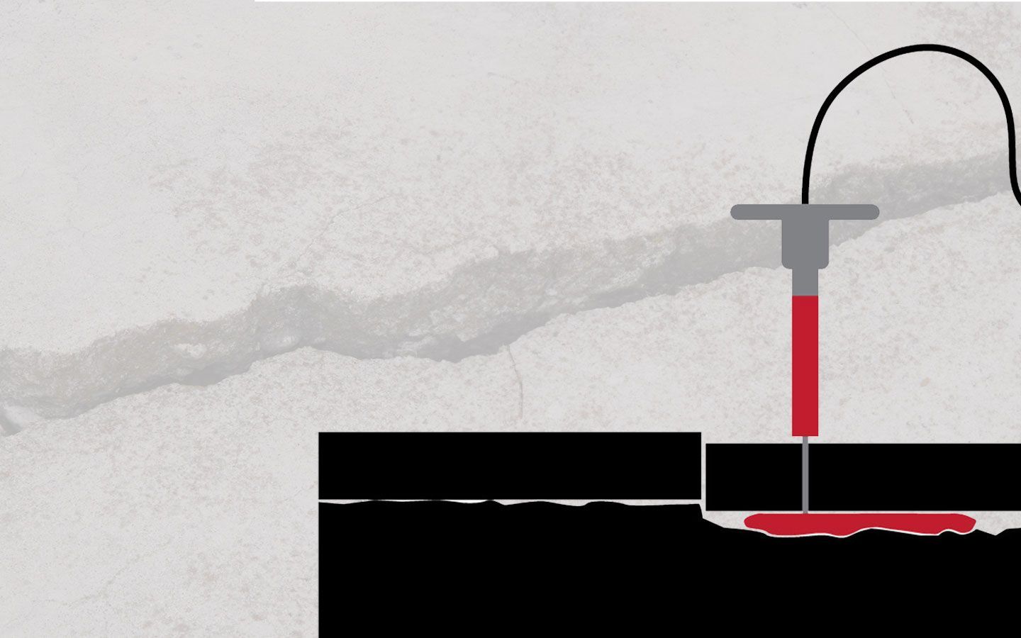 A tool filling a crack in a surface with red substance, likely sealant or repair material.