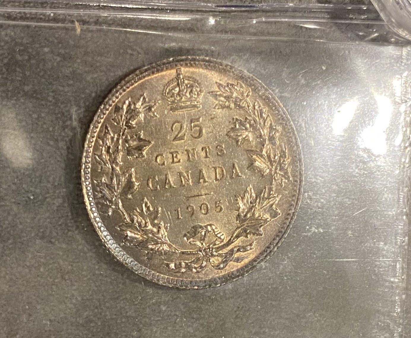 A close up of a 25 cent canadian coin