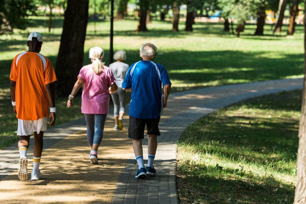 Several people walking down a nice path in the shade at Family Choice Home Care near Lexington, Kentucky