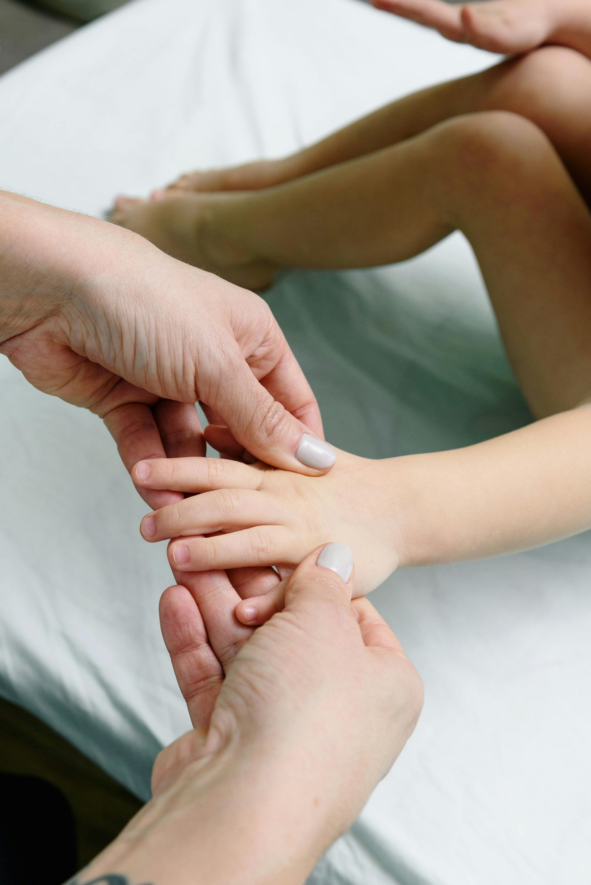 Physical therapist stretching out the leg of a patient