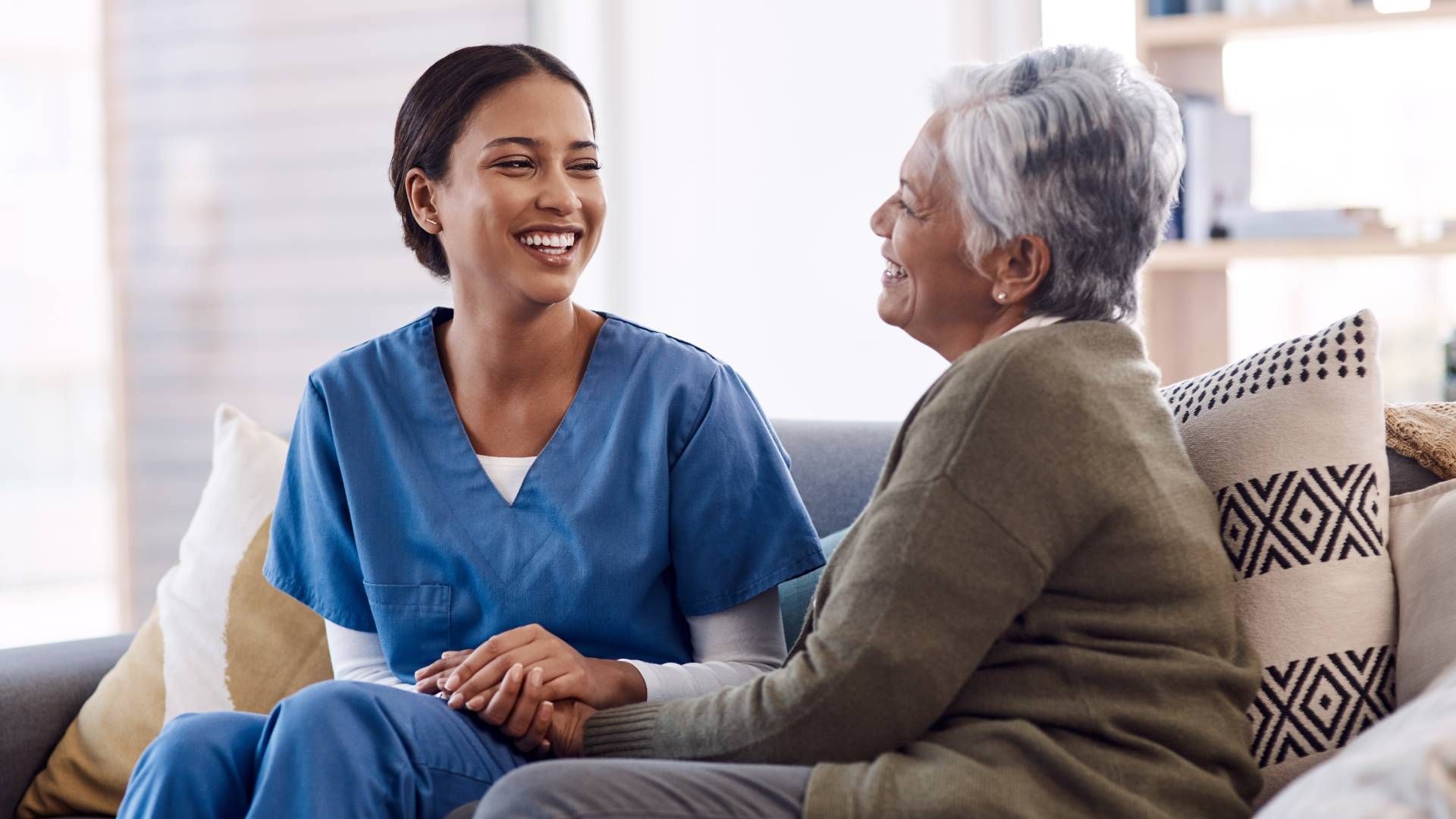 An in-home caregiver and a senior having a good conversatio at Family Choice Home Care near Lexingto