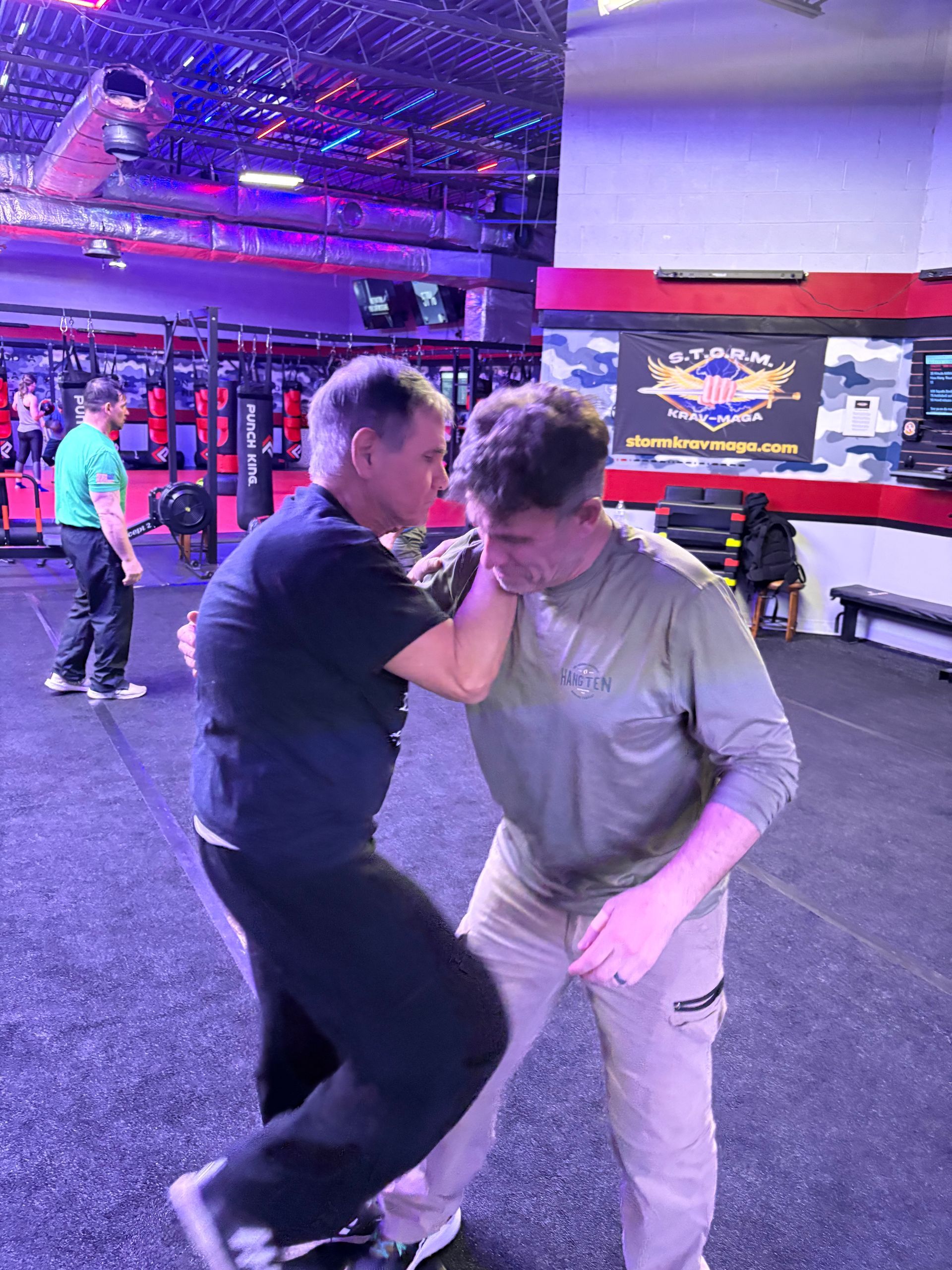 Adults practicing practical self-defense drills at Storm Krav Maga in Bohemia, NY to build real-world confidence.